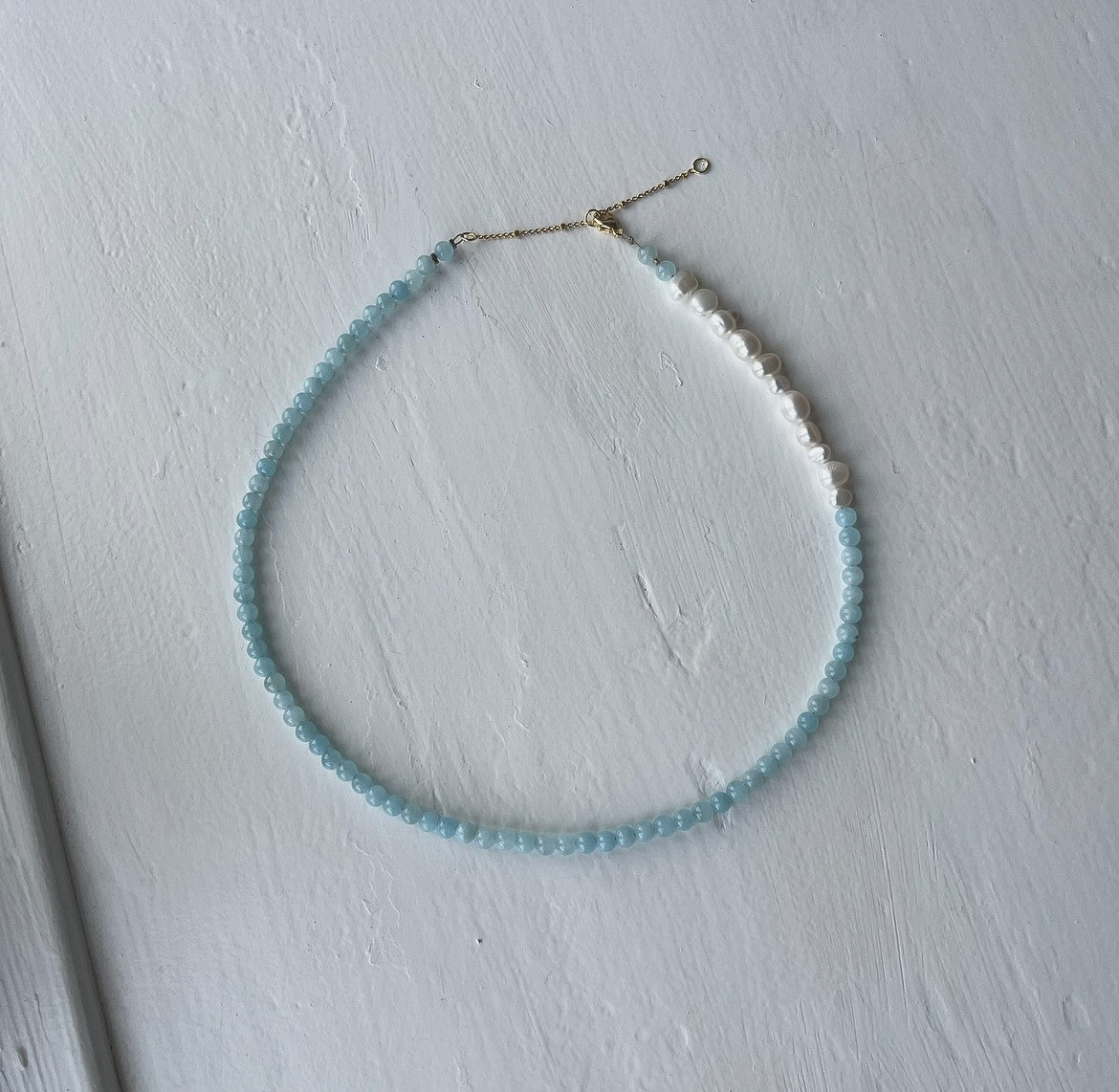Necklace with light blue beads and freshwater pearls