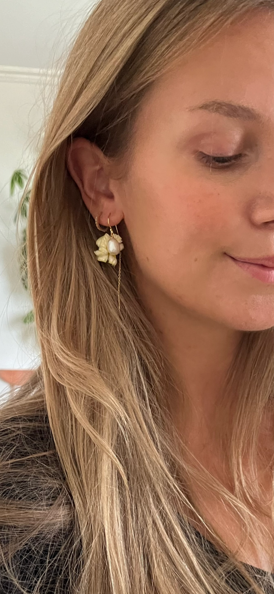 Flower-inspired earrings with freshwater pearls and yellow 'leaves'