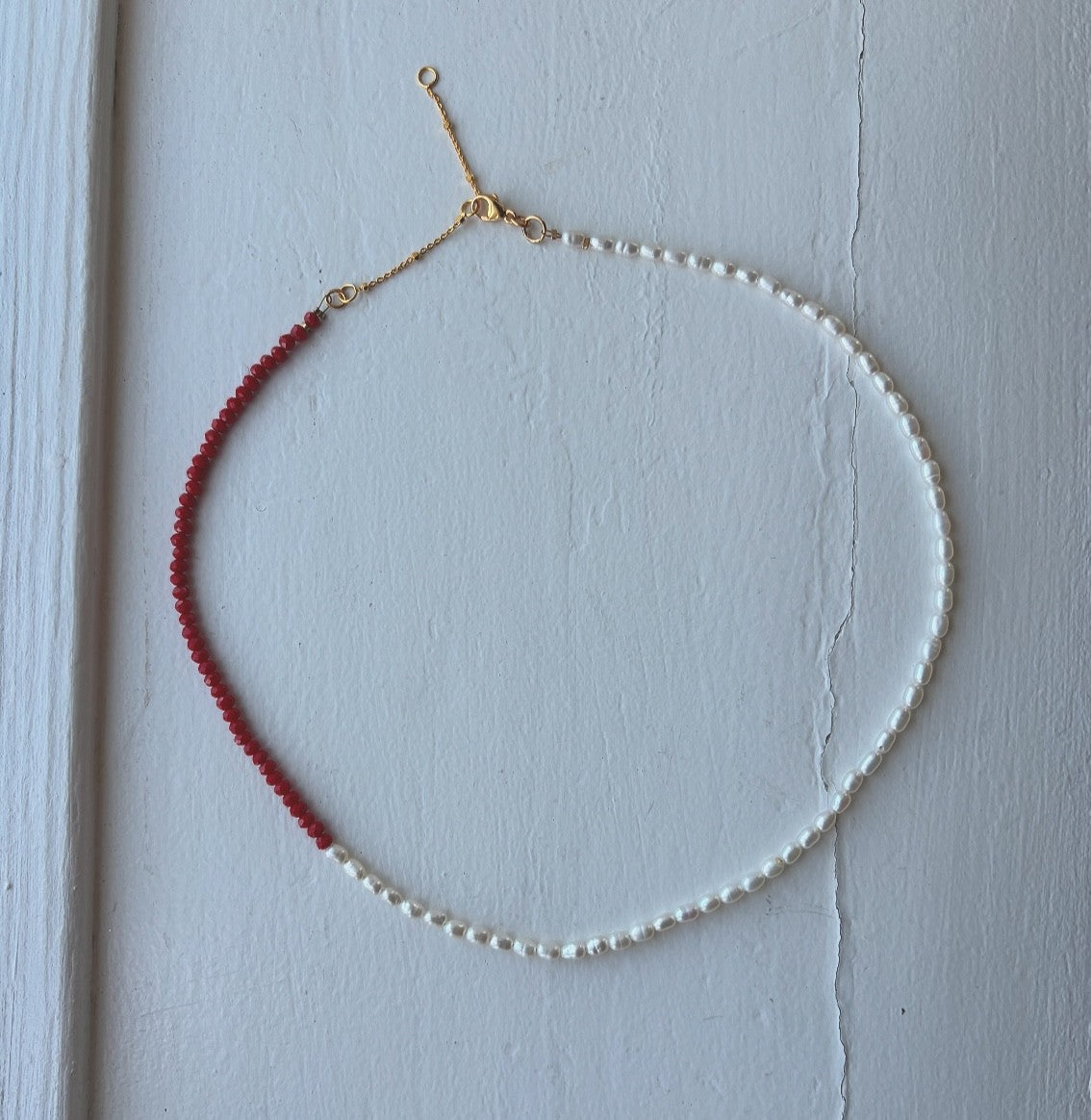 Necklace with small freshwater pearls and red glass beads