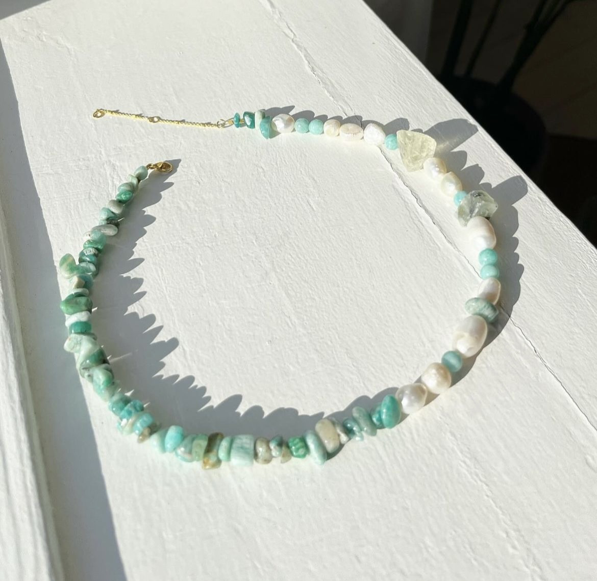 Necklace with freshwater pearls, stones, and crystals