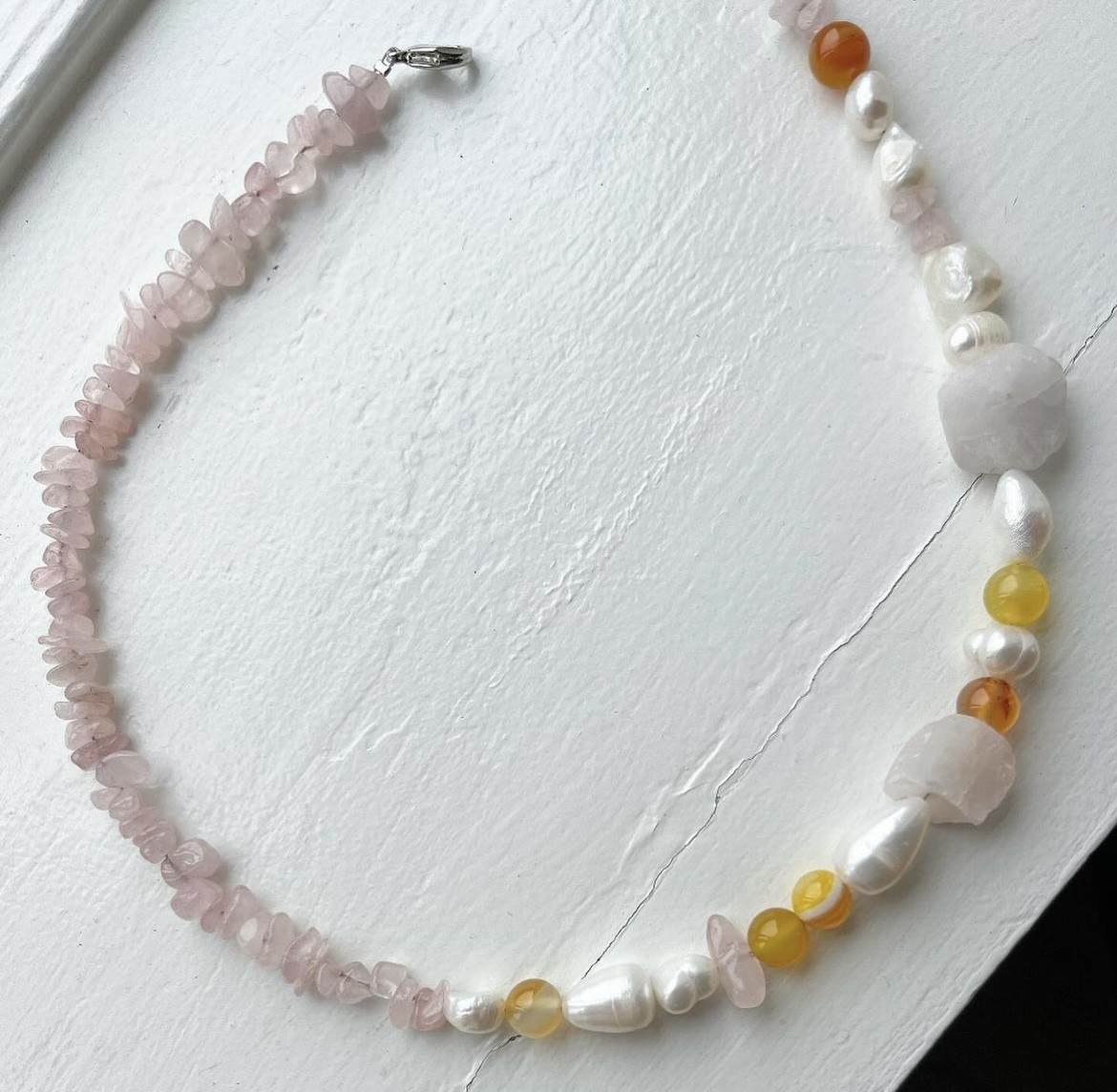 Necklace with freshwater pearls, stones, and crystals